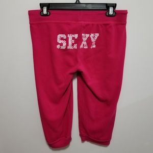 Grip pink capri pants with "sexy"
